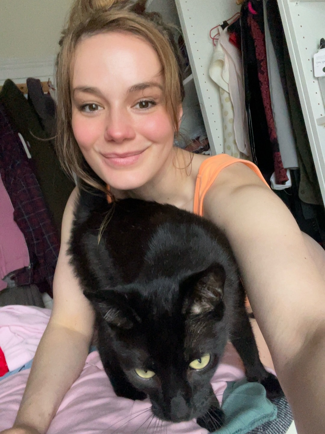Me at home with Yin, my black rescue cat.